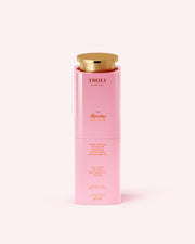 A pink cylindrical bottle of Truly Beauty’s The Hydrating Face Serum with a gold cap, featuring gold text. Infused with niacinamide, the bottle contains 1.7 fl oz (50 ml).