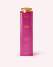 A bright pink bottle with a gold cap labeled “Truly Beauty The Smoothing Body Serum.” This 3.1 fl oz (90 mL) serum targets keratosis pilaris and rough, bumpy skin, as highlighted on its stylish packaging.