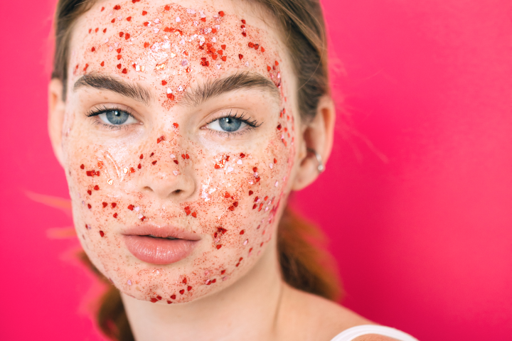 Young woman wearing glittery red face mask