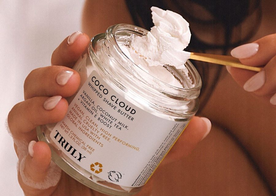 Does Shaving Gel or Cream Provide Closer Shave | truly's coco cloud shave butter being spooned out of jar