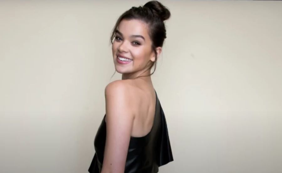 Hailee Steinfeld skincare routine | Hailee Steinfeld smiling wearing black dress