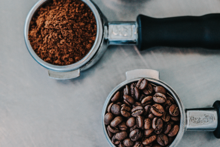  coffee beans and ground coffee in portafilters