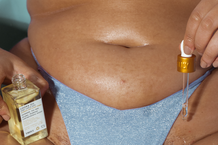 How to Stop Bleeding From Shaving | Woman applying cooka oil to bikini area