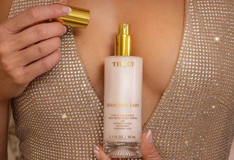 is hyaluronic acid good for stretch marks | Woman applying a cosmetic product with close-up of the product 