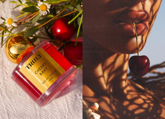 what is a gourmand scent | A vintage-style heart cake with white piped frosting sits on a gold plate alongside glass cosmetic bottles and newspaper