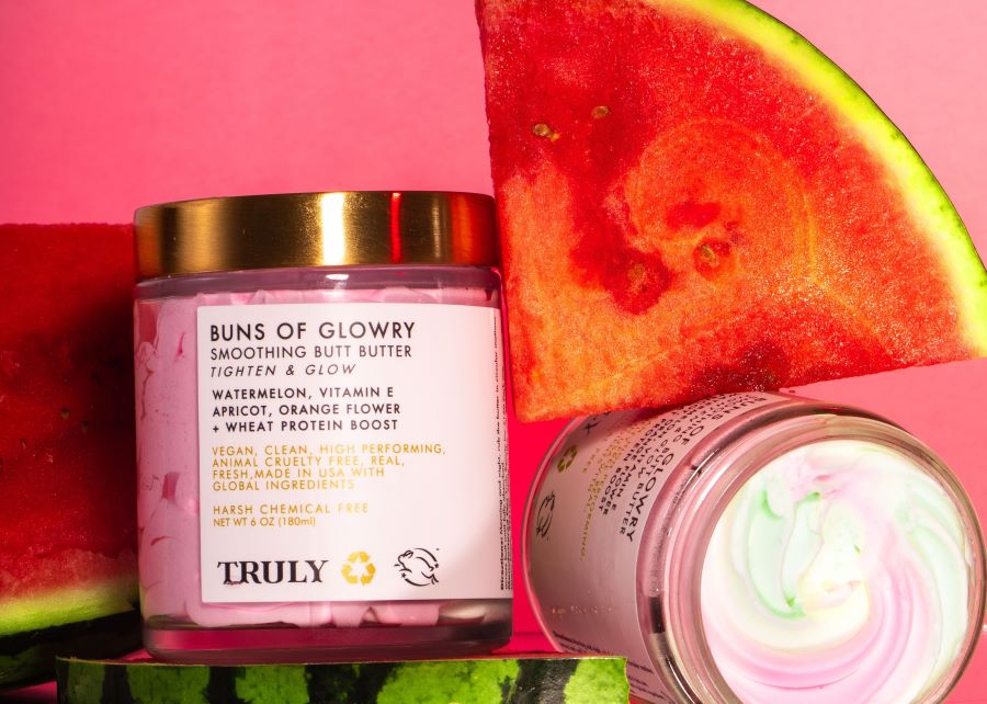 Clean skincare | Truly's buns of glowry butt butter next to watermelon slice