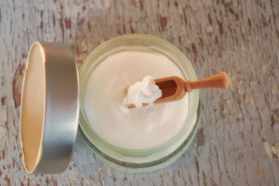 does coconut oil go bad? | jar of coconut oil with wooden spoon