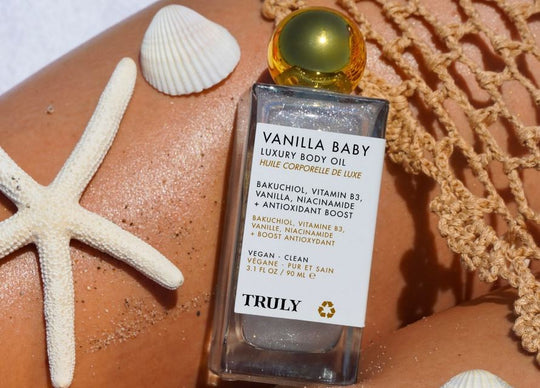 how to make perfume with essential oils | three truly beauty perfumes including vanilla baby, golden glaze, and unicorn fruit perfume on plate with roses