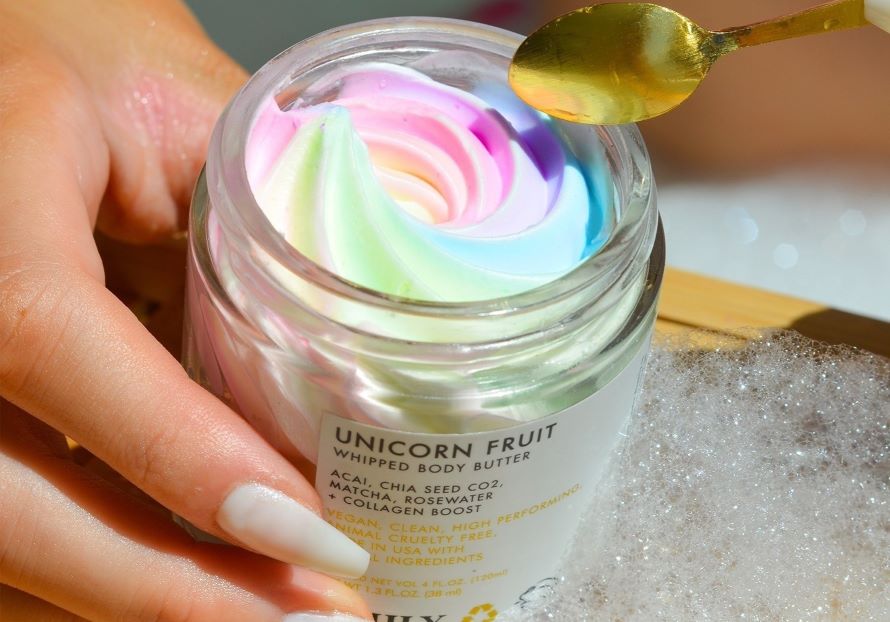mango butter vs shea butter | closeup of Truly's unicorn fruit body butter revealing colorful rainbow swirl