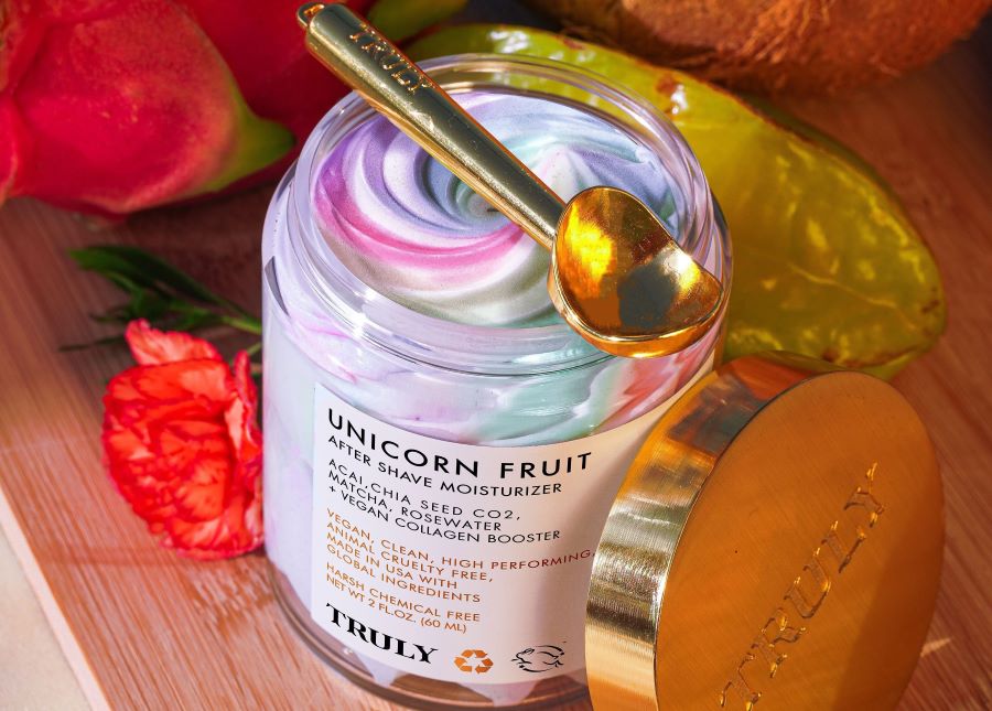 does shea butter clog pores | Open jar of Truly's Unicorn Fruit Body Butter revealing colorful swirl with golden scoop positioned on top