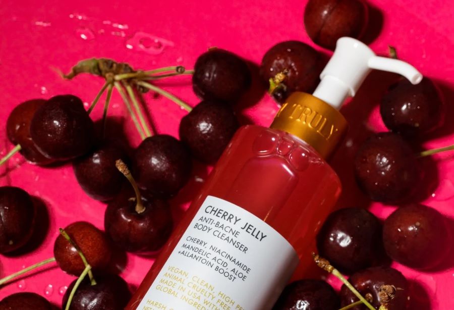 what does mandelic acid do for skin | Truly's cherry jelly body cleanser lying over fresh cherries