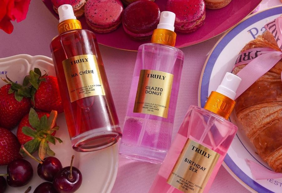 What is Body Mist? | Truly beauty body mists on table next to fruit and croissant