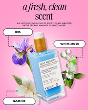 A bottle of Truly Beauty Jelly Booster Pigment Body Potion appears on a pink background, surrounded by iris, jasmine, and white musk illustrations. Text highlights its floral, musky scent and hyperpigmentation-lightening benefits.