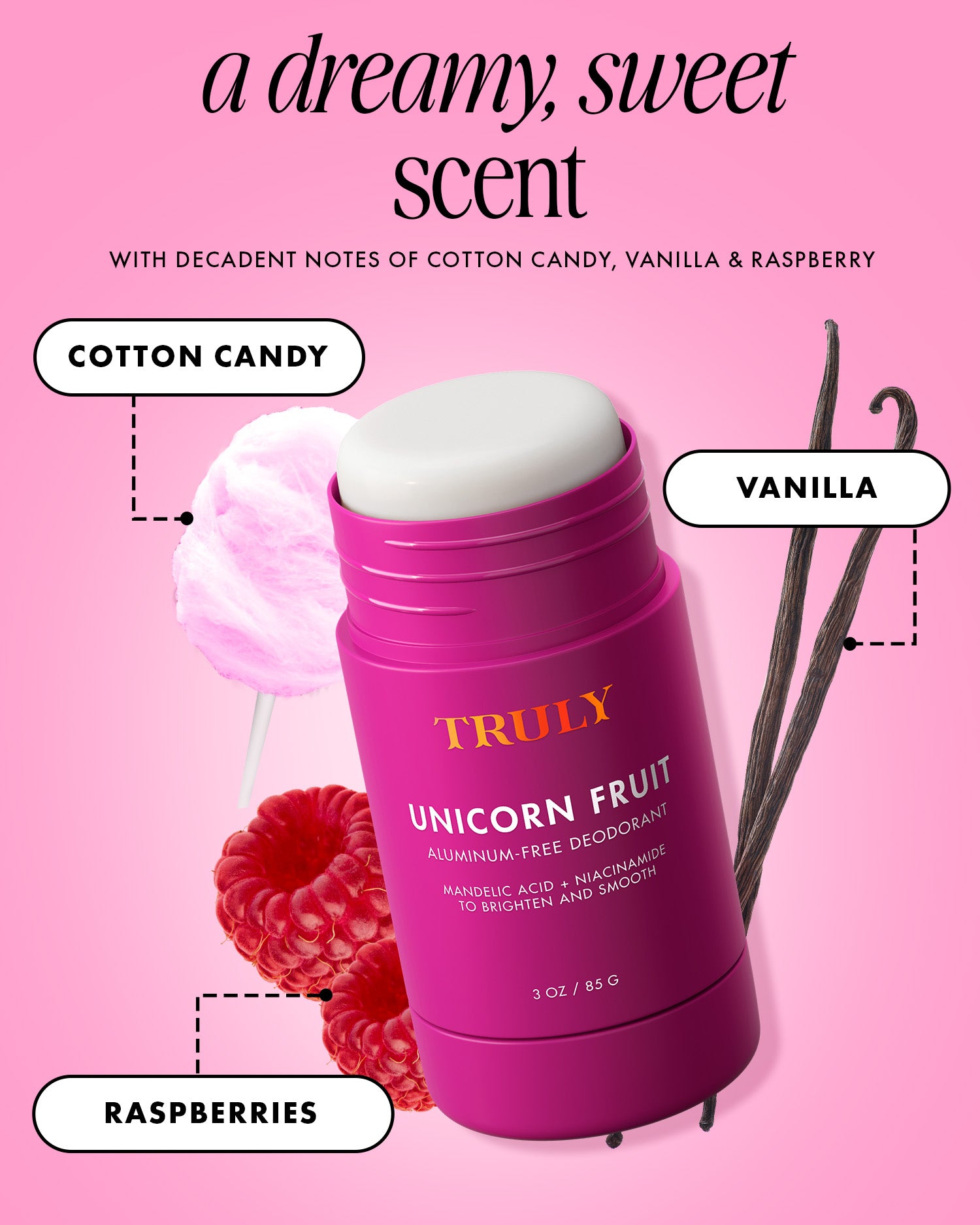 A bright pink, aluminum-free Unicorn Fruit Skin Brightening and Smoothing Deodorant by Truly Beauty is displayed with cotton candy, vanilla beans, and raspberries on a pink background. Text highlights its scent notes: cotton candy, vanilla, and raspberries.