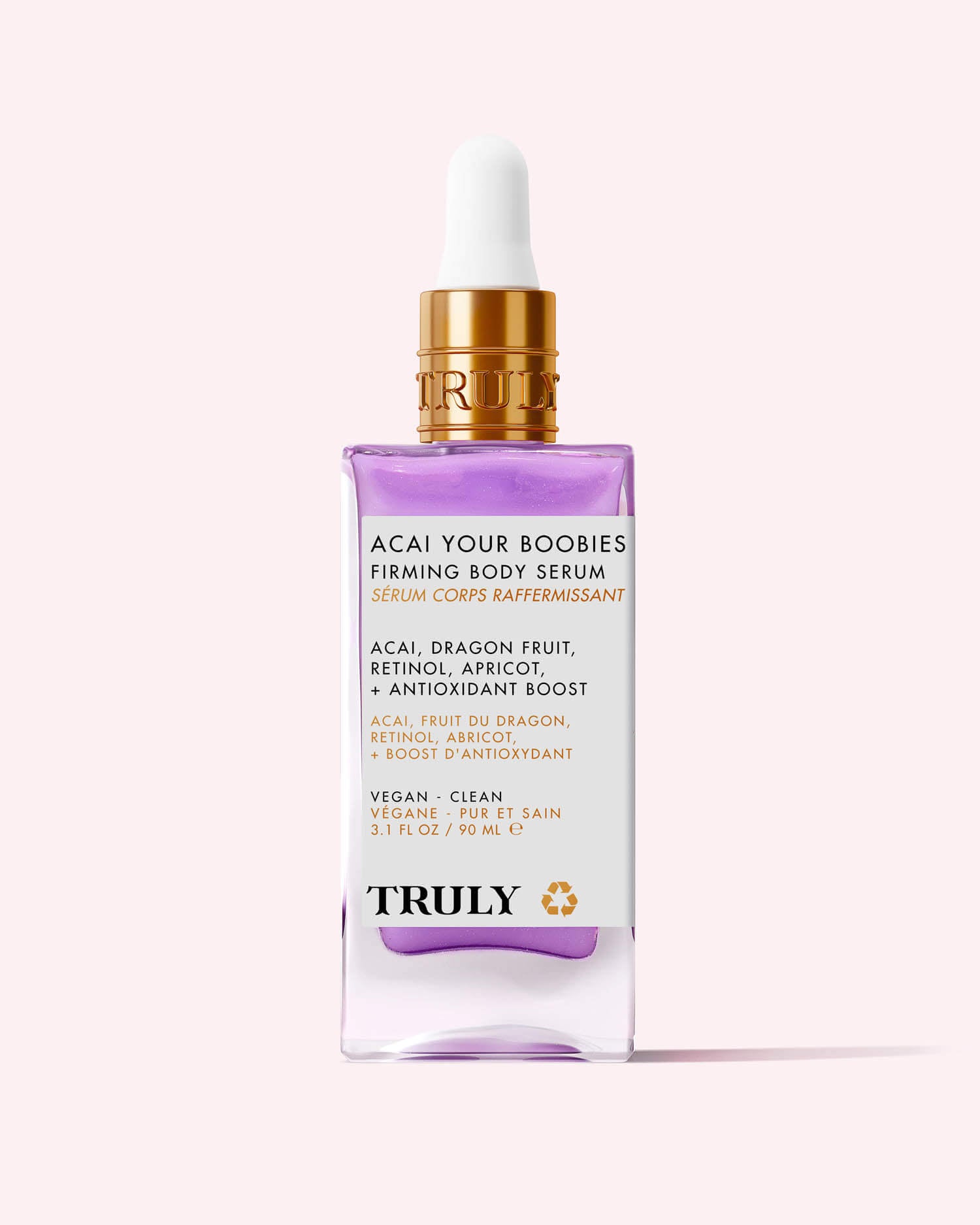 A bottle of Truly Beauty Acai Your Boobies Firming Body Serum with a gold dropper cap, highlighting its acai extract, retinol, apricot, and antioxidant-rich moisturizing formula on a light pink background.