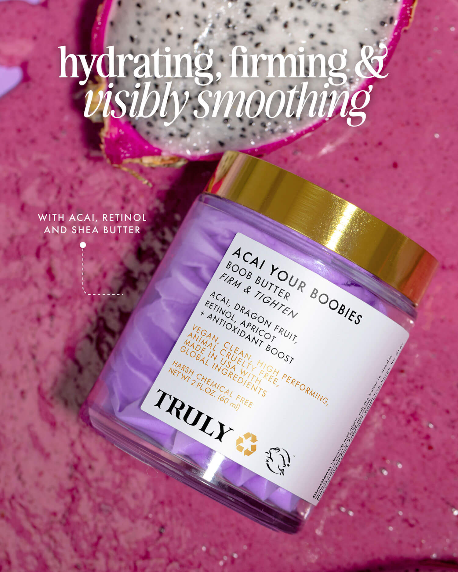 A jar of Acai Your Boobies Butter by Truly Beauty rests on a pink surface beside a halved dragon fruit. Text highlights the hydrating, firming, and smoothing skin benefits of this bestselling body butter.