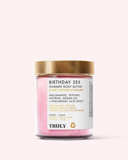 A 6.7 fl oz (198 mL) jar of Truly Beauty’s Birthday Sex Shimmer Body Butter features a gold lid, pink illuminating cream, and a label highlighting hydrating niacinamide, argan oil, and peptides.
