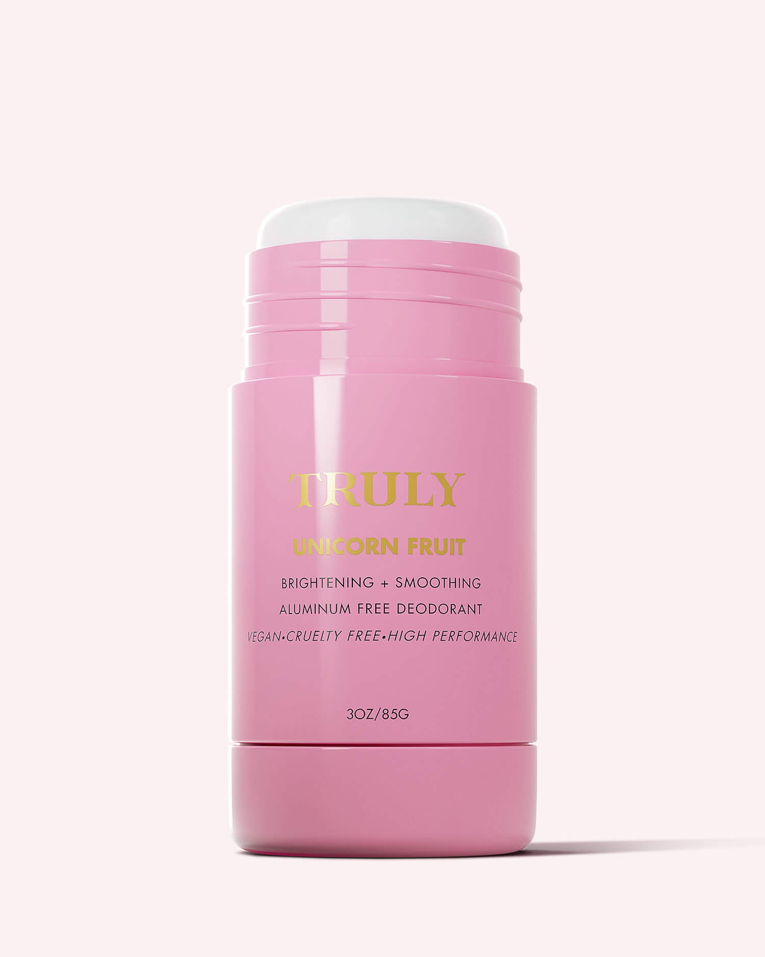Unicorn Fruit Skin Brightening and Smoothing Deodorant by Truly Beauty—a pink, aluminum-free, vegan stick (3oz/85g) with gold and yellow text—perfect for elevating your underarm care routine on a light pink background.