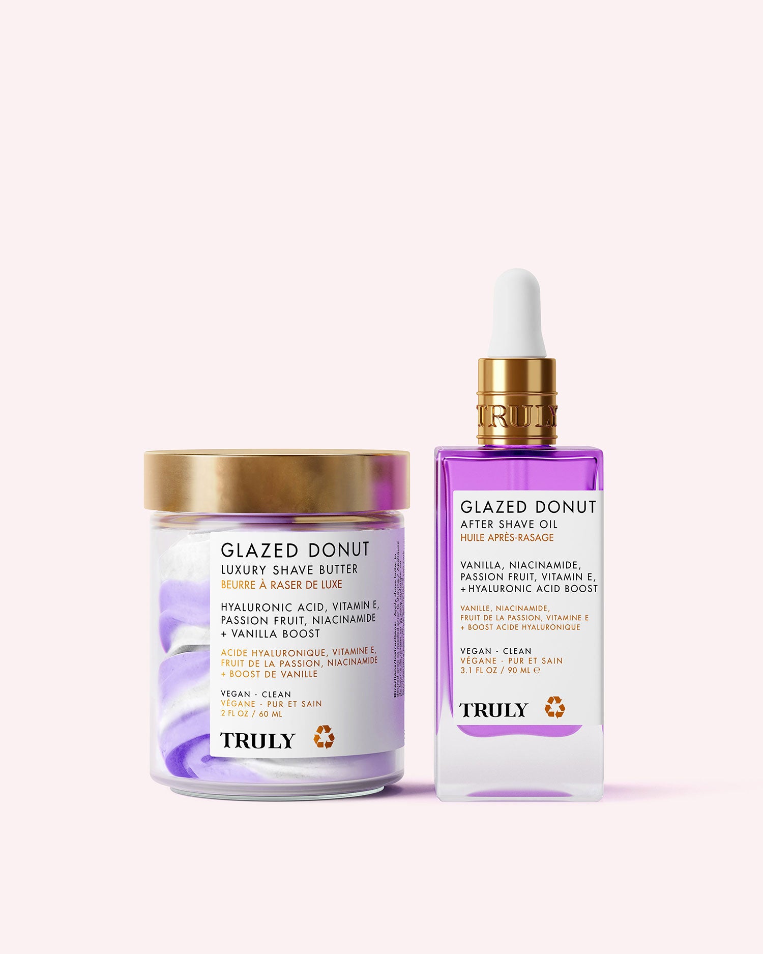 The Glazed Donut Duo by Truly Beauty includes a hydrating Shave Butter in a jar with a gold lid and a Shave Oil in a clear dropper bottle, both with purple and white accents.