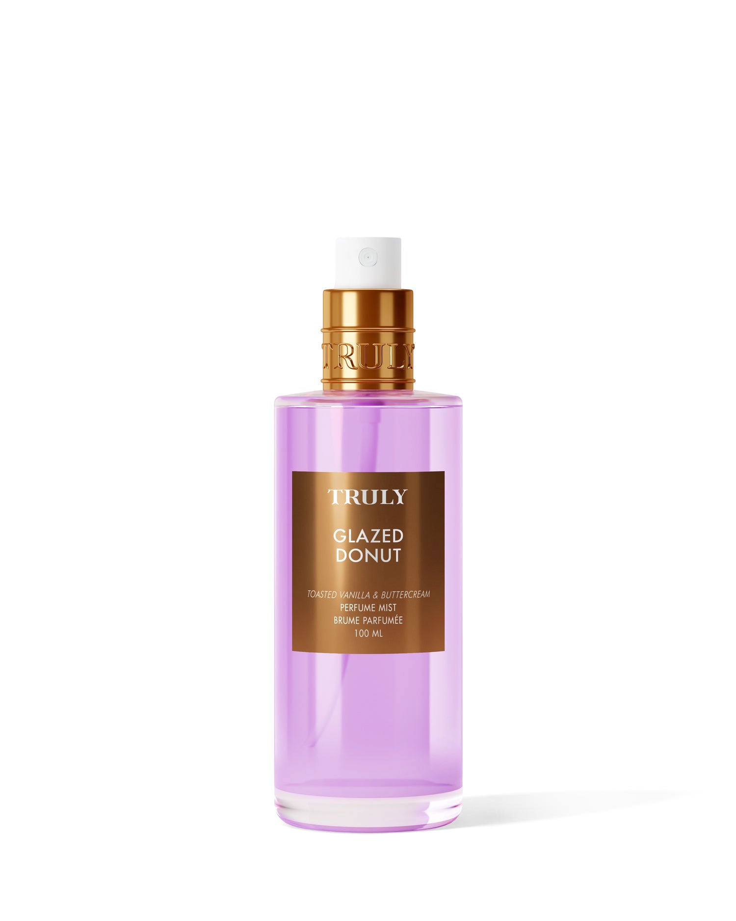 A clear bottle of Truly Beauty’s Glazed Donut Perfume Mist features purple liquid, a gold cap, and a brown label with gold text—ideal for gourmand fragrance fans craving toasted vanilla notes.