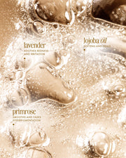 Close-up of golden Cooka Oil bubbles by Truly Beauty with text: “Lavender soothes redness,” “Primrose fades hyperpigmentation,” and “Jojoba oil heals ingrown and pubic hair.”.