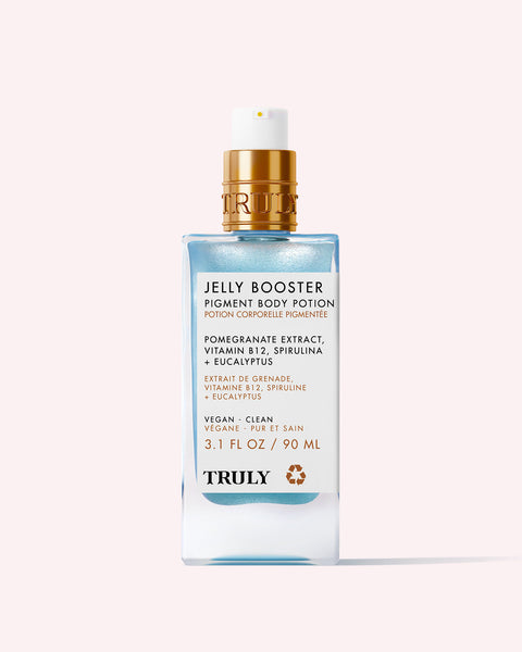 A 3.1 fl oz (90 ml) bottle of Truly Beauty's Jelly Booster Pigment Body Potion serum features blue liquid, a gold and white pump, and a label listing pomegranate extract, vitamin B12, and spirulina among its ingredients.