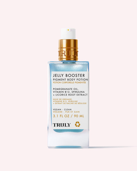 A blue and gold pump bottle of Truly Beauty’s Jelly Booster Pigment Body Potion, a vegan hyperpigmentation serum with pomegranate extract, vitamin B12, spirulina, and licorice root in a 3.1 fl oz (90 ml) size on a pale background.