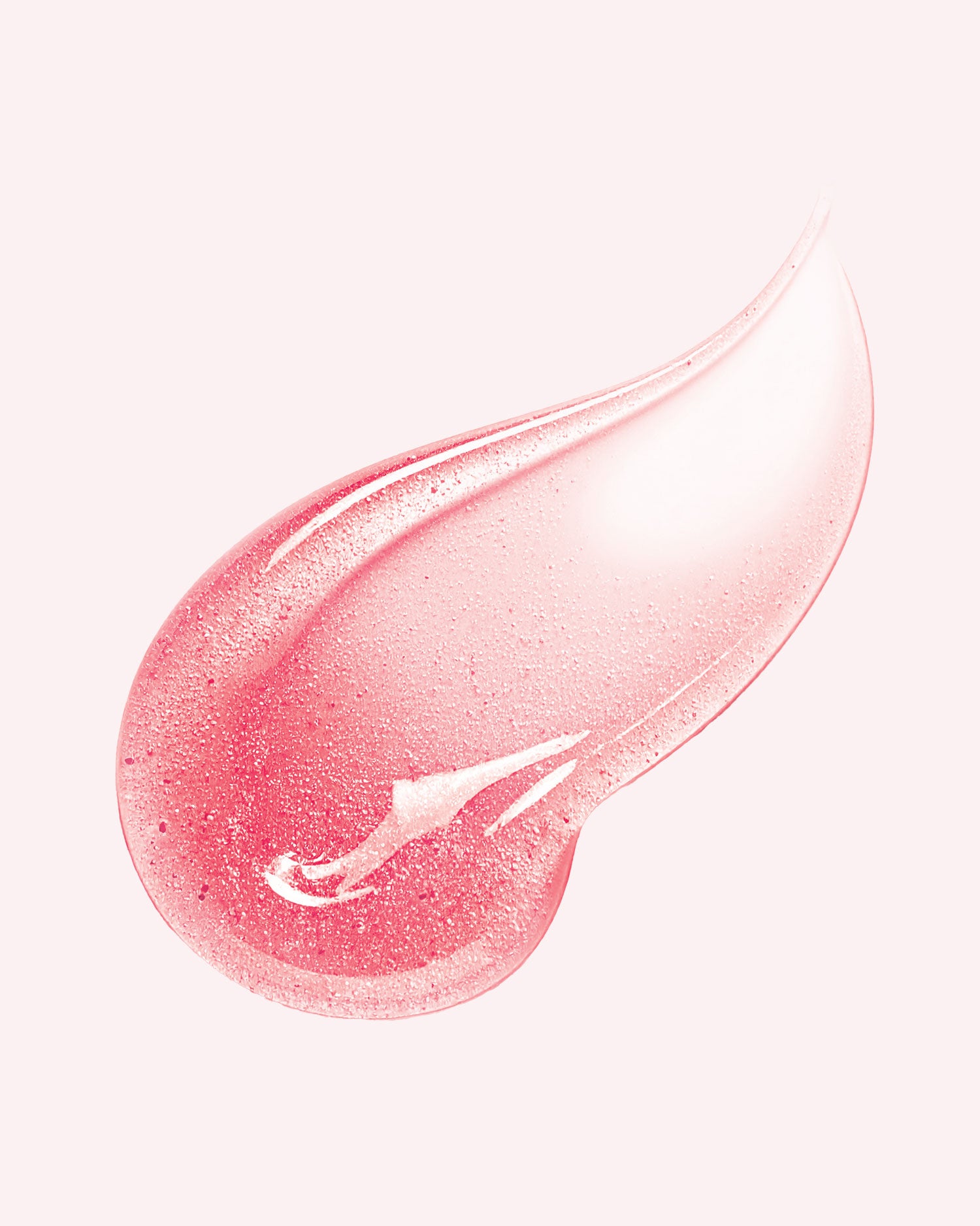 A close-up of The Luxury Peptide Lip Oils by Truly Beauty, featuring a pink, translucent swatch with a smooth, glossy texture on a light background.