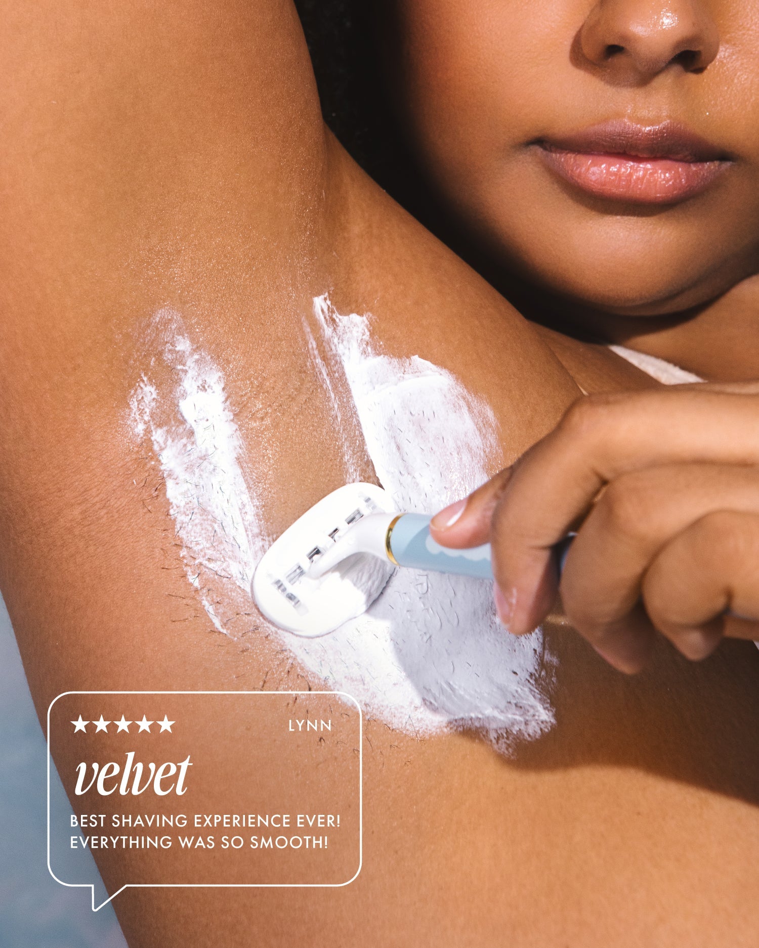 A person shaves their underarm with a razor covered in Truly Beauty’s Coco Cloud Luxury Shave Butter. Text on the image reads: ★★★★★ Lynn. Velvet. Best shaving experience ever! Everything was so smooth!.