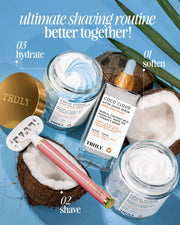 Three Truly Beauty products from the Ultimate Coco Cloud Shave Set, including jars and a dropper bottle, are arranged on a blue surface with coconut halves. Text highlights the routine: soften, shave, hydrate.