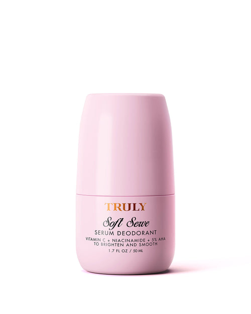 Pink serum deodorant bottle labeled 'Truly Soft Serve' on a white background