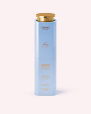 A tall, light blue cylindrical bottle with a gold cap labeled Truly Beauty The Firming Body Serum, this peptide serum features gold and white text and contains 3.1 fl oz (96 ml) of product.