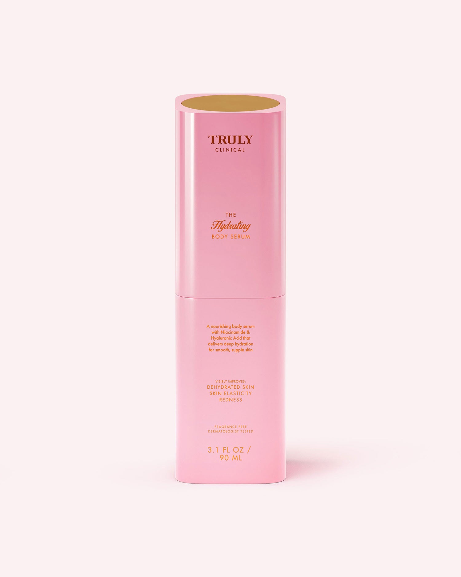 A tall, cylindrical pink bottle of Truly Beauty's The Hydrating Body Serum (3.1 fl oz/90 ml), with hyaluronic acid and niacinamide, features gold text and a gold inner lid, set against a light pink background.