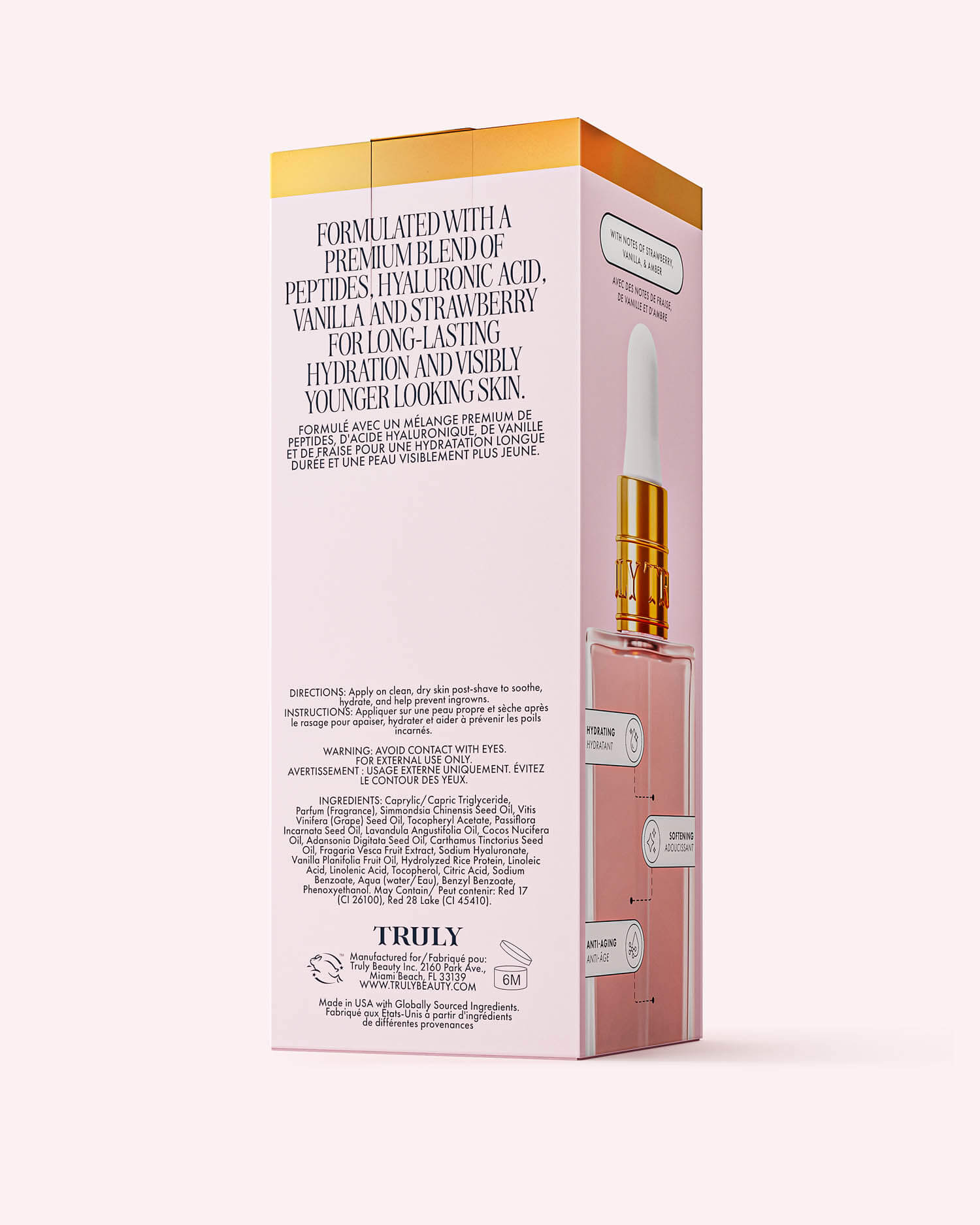A pink and gold box of Soft Serve After Shave Oil by TRULY features hyaluronic acid, peptides, vanilla, and strawberry. Includes an image of a dropper bottle—ideal for silky-smooth skin after shaving.