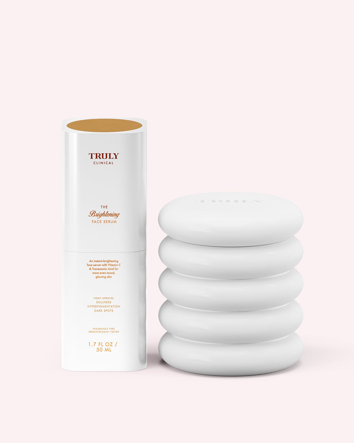A white, ribbed jar of Truly Beauty’s Cloud Cream Pro-Peptide Facial Moisturizer sits beside its white, gold-accented box with a cutout displaying the jar. Both are set against a pale pink background.