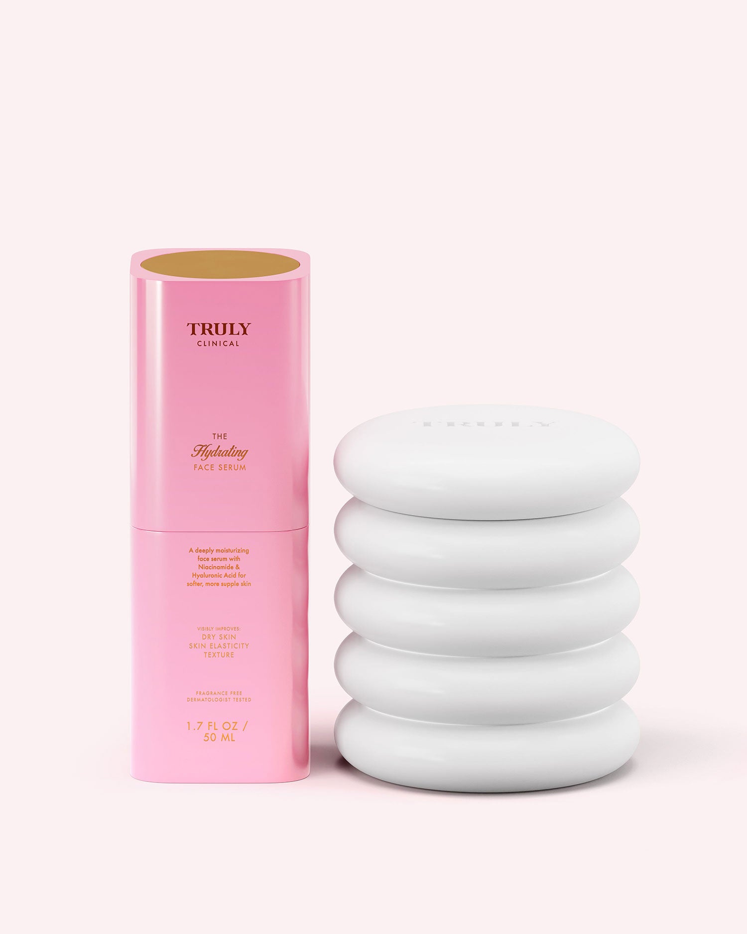 A pink cylindrical bottle of Truly Beauty The Hydrating Face Serum with gold text stands upright on a light pink background. The partially open bottle reveals the inside of the cap.