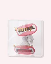 Two Razor Cartridges by Truly Beauty are packaged in a clear plastic box with gold TRULY and RAZOR HEAD text. The pink and white design on a light pink background promises a silky smooth shave every time.