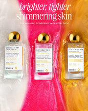 Truly Beautys Luxury Body Oil Trio is showcased on a shimmering pink, white, and gold background with “brighter, tighter shimmering skin” above, featuring three luxe body oils for radiant skin.