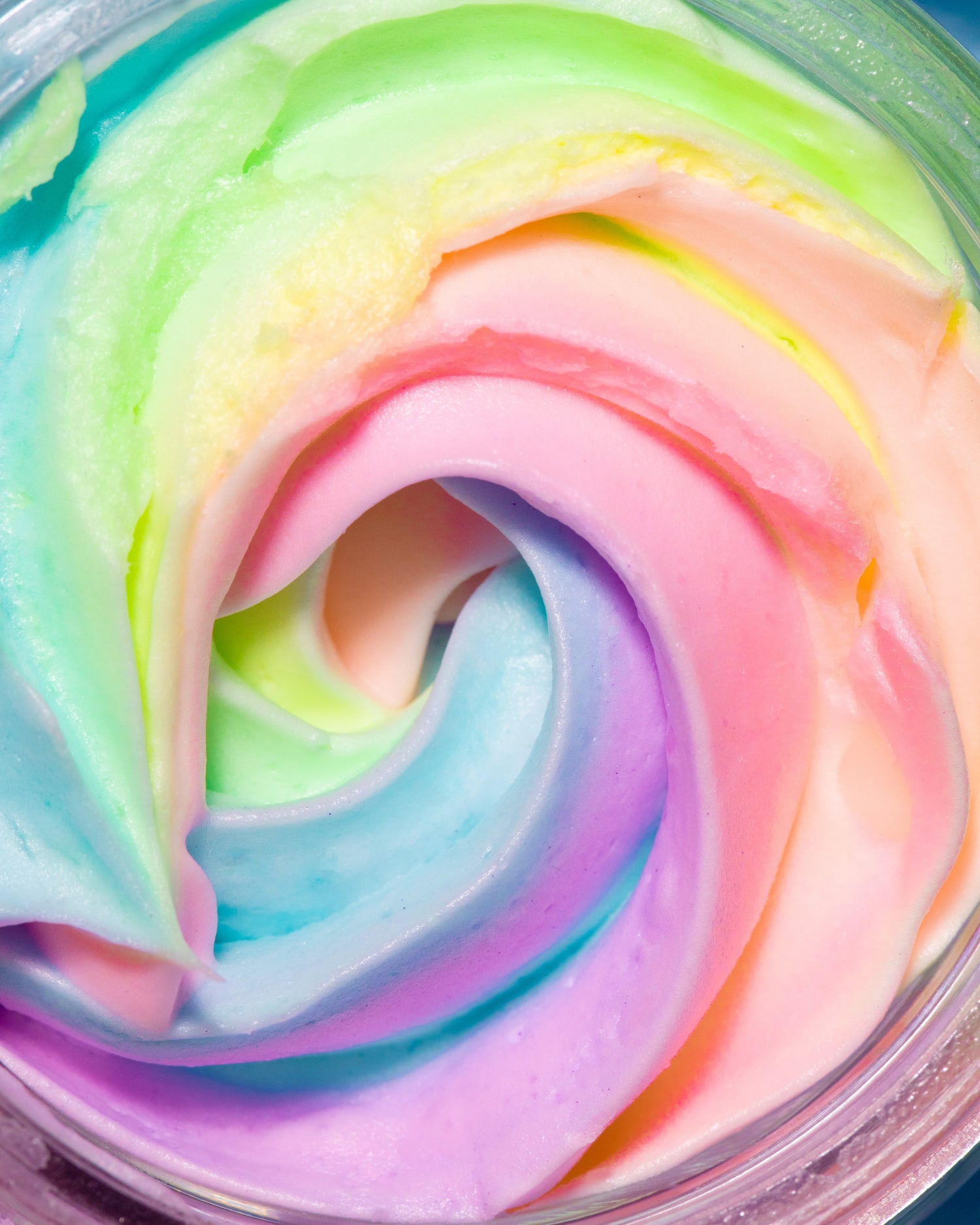 Truly Beauty’s Unicorn Fruit Duo features pastel rainbow swirls in pink, blue, green, yellow, and purple with a creamy texture and sweet cotton candy scent—just like whipped body butter.