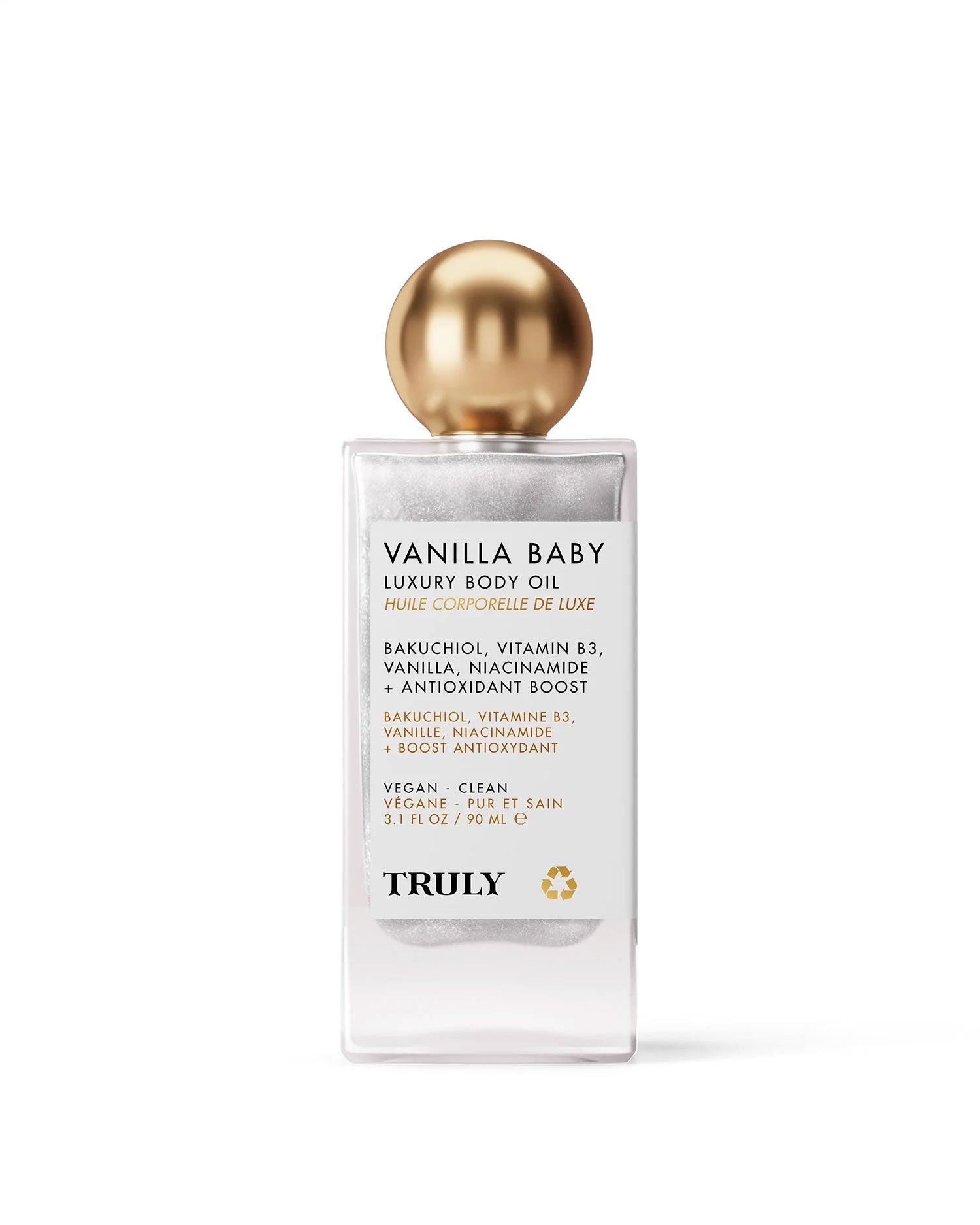 A clear bottle of Truly Beauty Vanilla Baby Luxury Body Oil with a gold cap, featuring bakuchiol, vitamin B3, and niacinamide for anti-aging, clean beauty, vegan-friendly formulation, and plumping benefits.