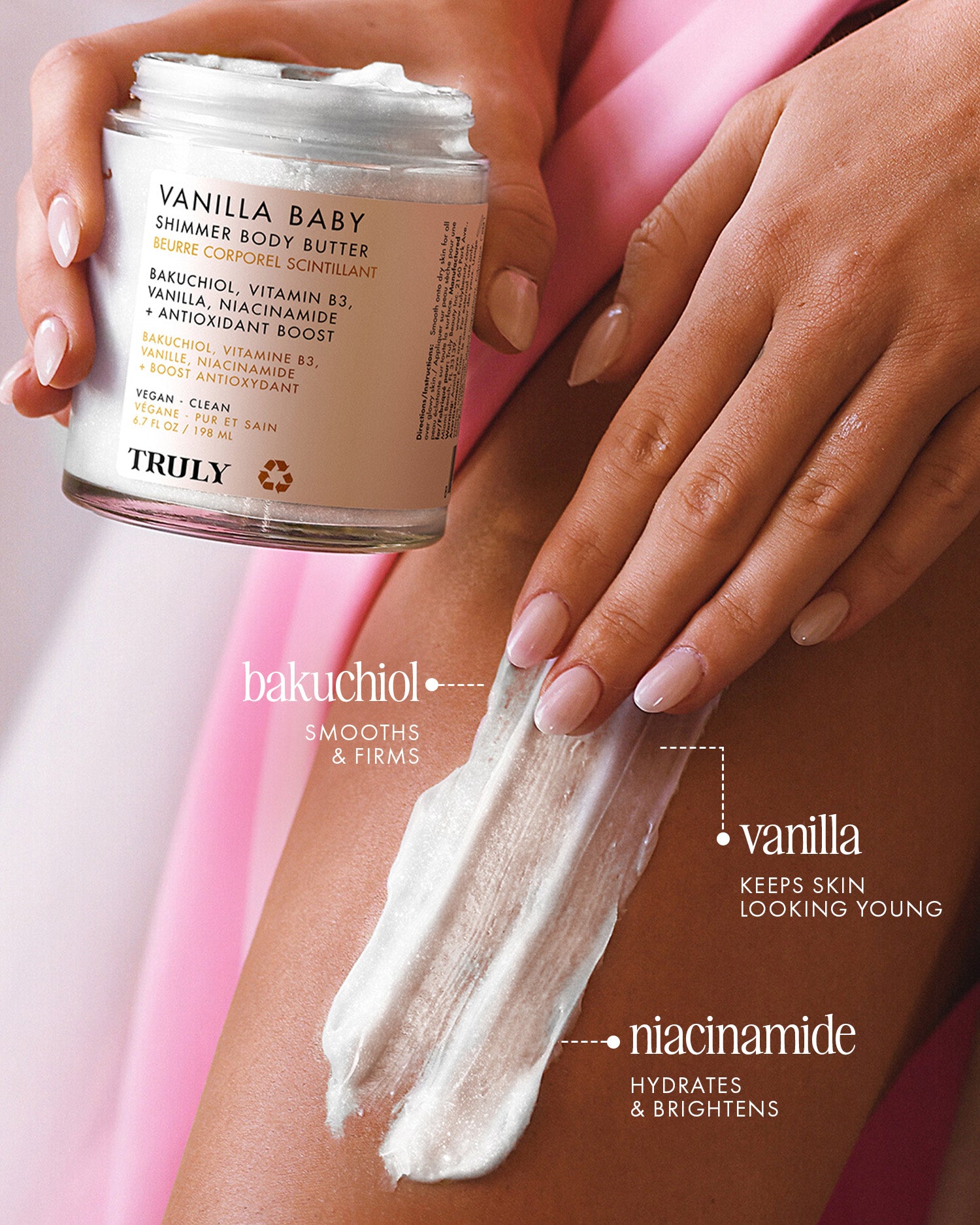 A hand holds a jar from the Vanilla Baby Luxury Trio by Truly Beauty, while another applies cream to a leg. Text highlights bakuchiol, warm vanilla scent, and niacinamide for luminous, hydrated, youthful-looking skin.