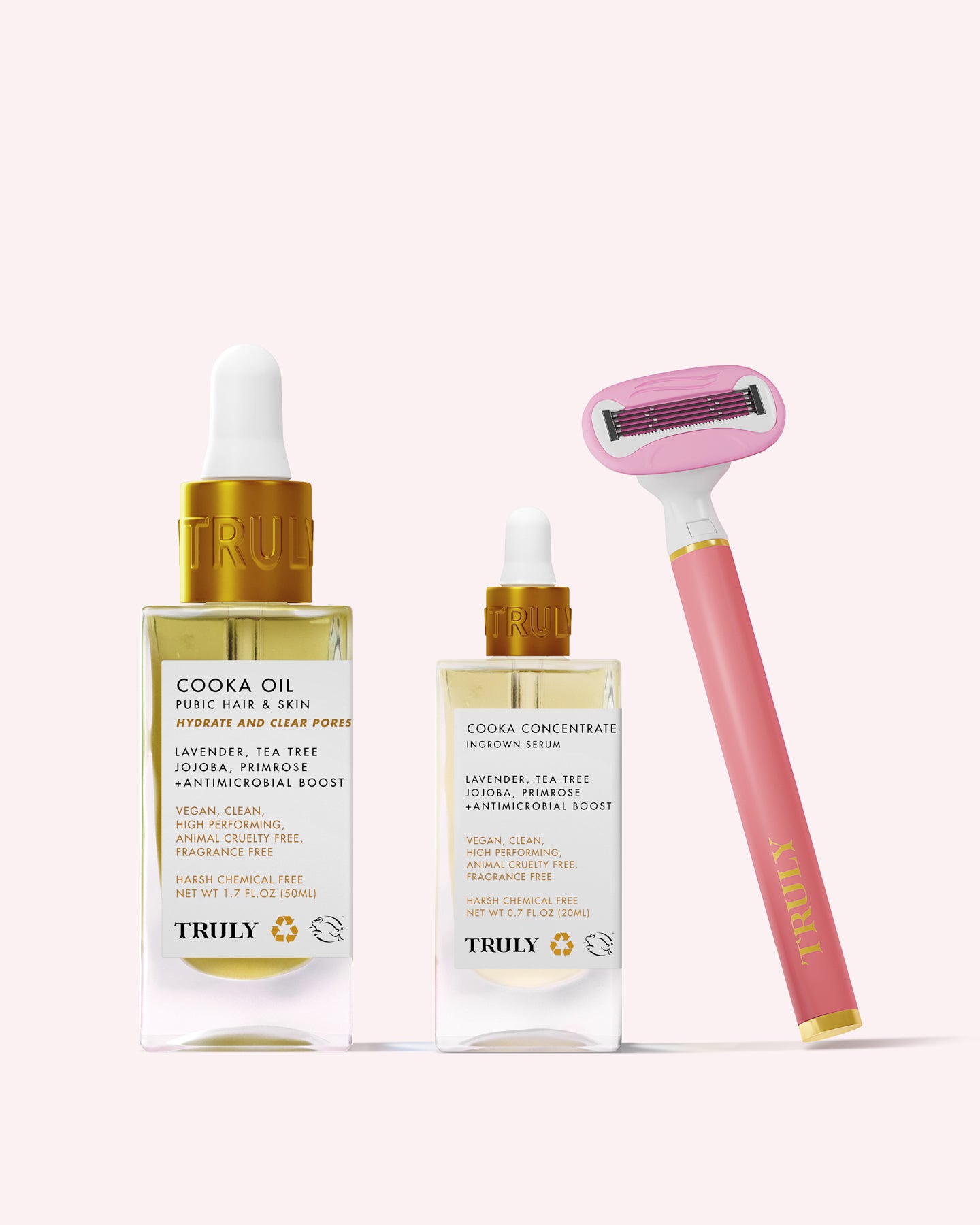 The Truly Beauty Cooka Set features two labeled dropper bottles and a double-bladed razor—ideal for your bikini line—arranged against a soft pink background.