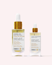 Two glass dropper bottles of Truly Beautys Cooka Routine, featuring tea tree-scented, vegan, chemical-free formulas with lavender and jojoba to help prevent ingrown hairs in the pubic area.