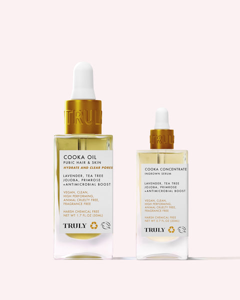 Two glass dropper bottles of Truly Beautys Cooka Routine, featuring tea tree-scented, vegan, chemical-free formulas with lavender and jojoba to help prevent ingrown hairs in the pubic area.