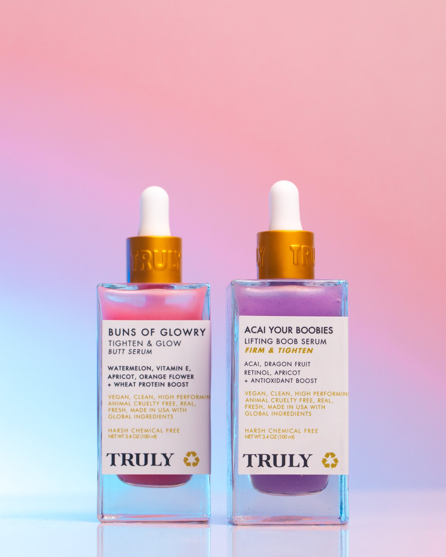 Two colorful bottles of Truly Beauty’s Body Serum Duo, featuring Buns of Glowry Butt Serum and Acai Your Boobies Lifting Boob Serum with acai for anti-aging, shown against a pink and blue gradient background.